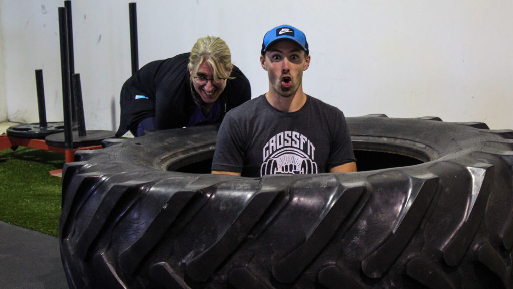 coach sitting in a large tire
